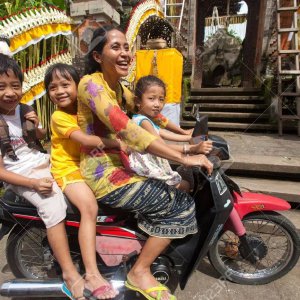 scooter woman and kids traveling.jpg